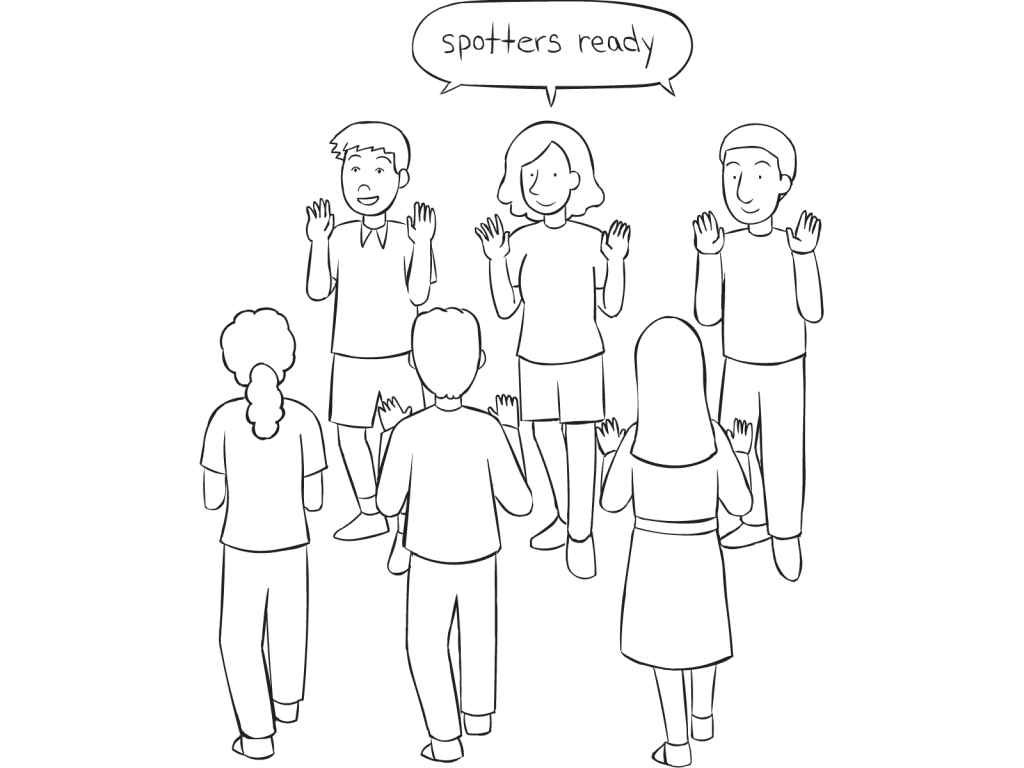 Two lines of people facing each other ready for the trust-building activity called The Gauntlet