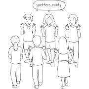 Two lines of people facing each other ready for the trust-building activity called The Gauntlet