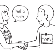 Two people shaking hands in a fun get-to-know-you Name-Tag game