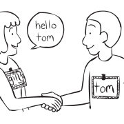 Two people shaking hands in a creative icebreaker activity Name-Tag Mania