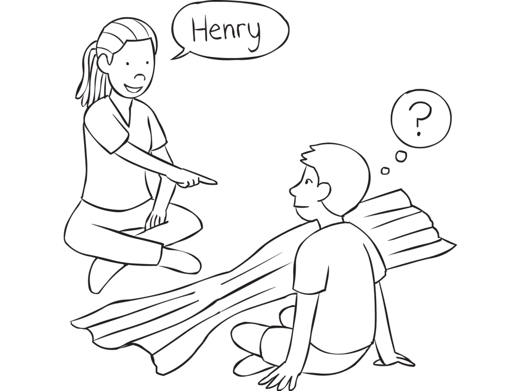 Two people sitting either side of a dropped blanket facing one another, playing quick name game Peek-A-Who