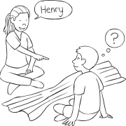 Two people sitting either side of a dropped blanket facing one another, playing quick name game Peek-A-Who