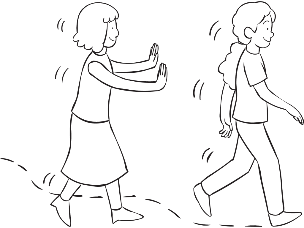 One woman spotting behind another woman as part of Walk and Lean active trust-building game