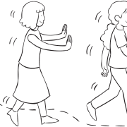 One woman spotting behind another woman as part of Walk and Lean active trust-building game