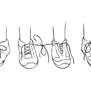 Two pairs of shoes with laces of two shoes tied together, as featured in creative partner exercise called Tiny Teach