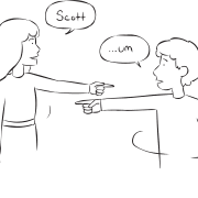 Two people pointing to each other as part of movement name game Name Roulette