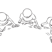 Overhead view of group sitting in circle passing shoes to one another in rhythmic passing game I Pass This Shoe