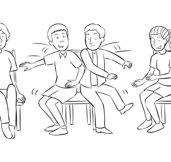 Two men bump into each other as they attempt to sit on same chair in fast game of The Wave fun group energiser