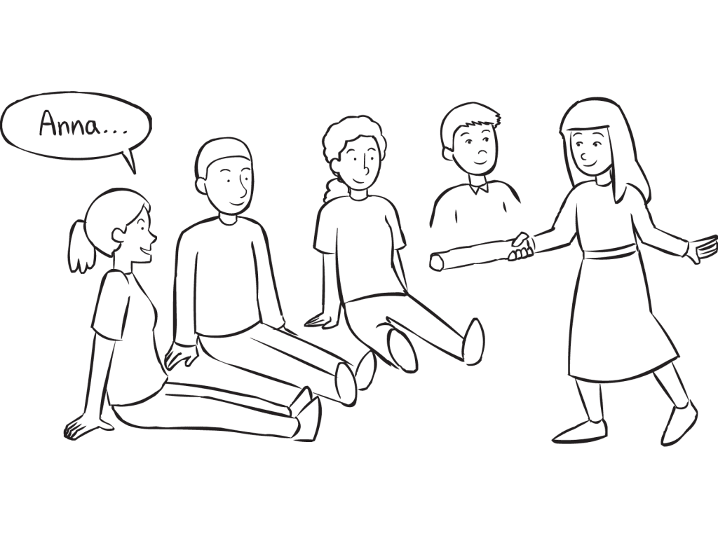 Group of people sitting on the floor watching a woman attempt to tag them in fast-paced name game called Wampum