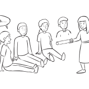 Group of people sitting on the floor watching a woman attempt to tag them in fast-paced name game called Wampum