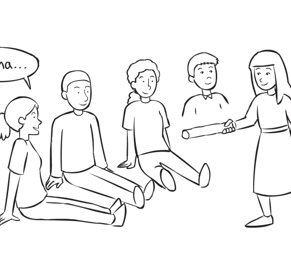 Group of people sitting on the floor watching a woman attempt to tag them in fast-paced name game called Wampum