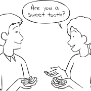 Two people holding sweets playing the fun get-to-know-you game Mintie Game