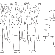 Woman running through the centre of two lines of people, as seen in advanced trust-building exercise called Trust Wave