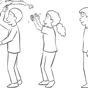 People lined up back to back passing a rubber chicken over and under their heads, as seen in team energiser game called Chicken Baseball