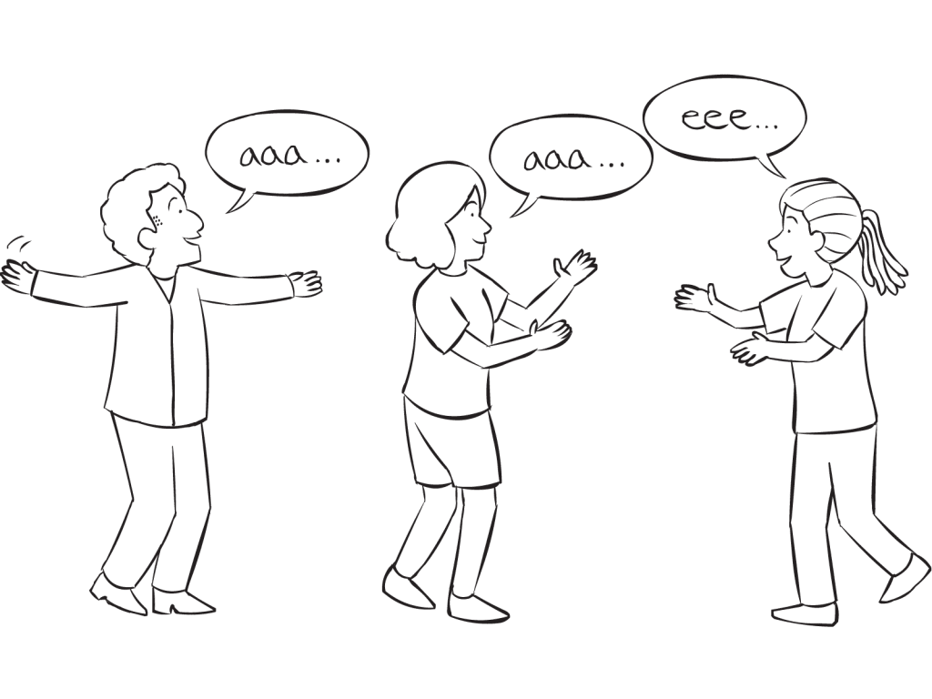 Three people singing the sound of their names in vocal energiser game Vowel Orchestra