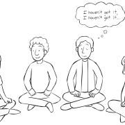 Group of people sitting in circle playing The Rock observation skills game.