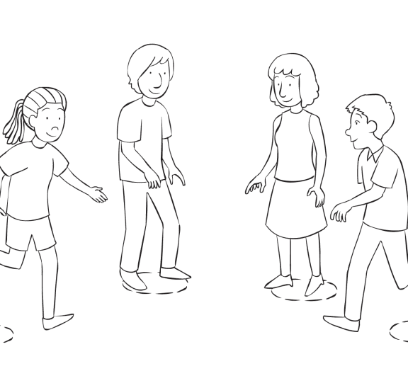 Group of people moving places in a circle, as seen in energetic circle game called Commitment