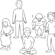 Group of people standing and sitting as part of fun get-to-know-you game called Sit Down If...