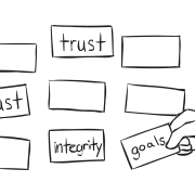 Series of index cards with words of different values written on them as used in team values memory game called Memory Card game