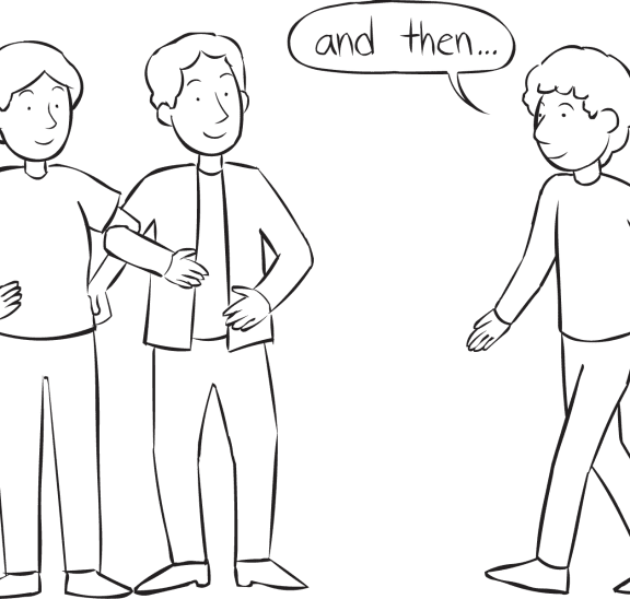 Man walking over to two interlocked people in Build A Story group storytelling activity