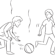 Man hitting ball with open hand towards another person, as seen in active elimination game Ga-Ga