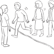 Group of people walking across a rope on the ground, as part of About Now group initiative
