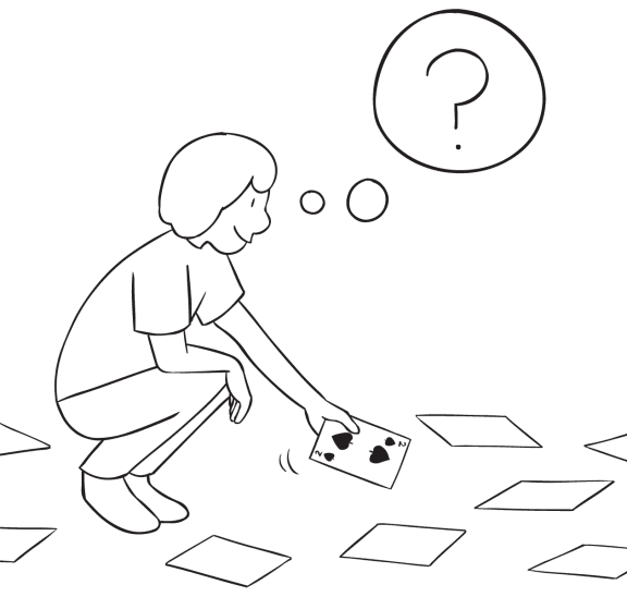 Person bending down picking up card playing Over There group continuous improvement activity