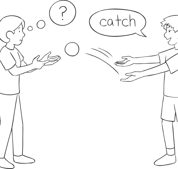 Two pleople passing a ball as part of Push Catch quick reaction game