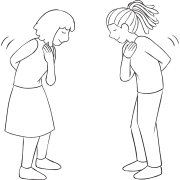 Two women playing a role play activity greeting each other as if they were royal members