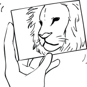 Hand holding a photo of a lion as part of Panic Picture creative storytelling activity