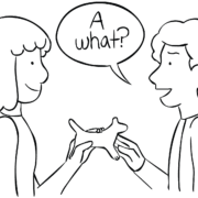 Two people passing an object as part of the circle passing game called A What?