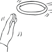 Person about to catch rubber ring as part of throwing team game Dolphin Golf