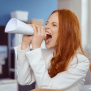 Woman using attention-getting device