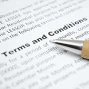 terms & conditions on paper with pen