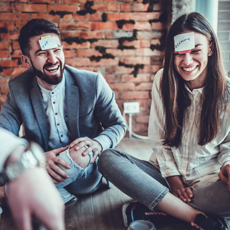 Man & Woman playing Celebrity Heads Game Kit