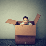 Introverts like this woman peering out of a box