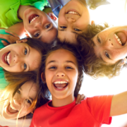 Happy children faces playing icebreakers and brain breaks
