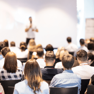 Man presenting to conference group