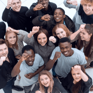 Multi-racial young adults cheering looking up