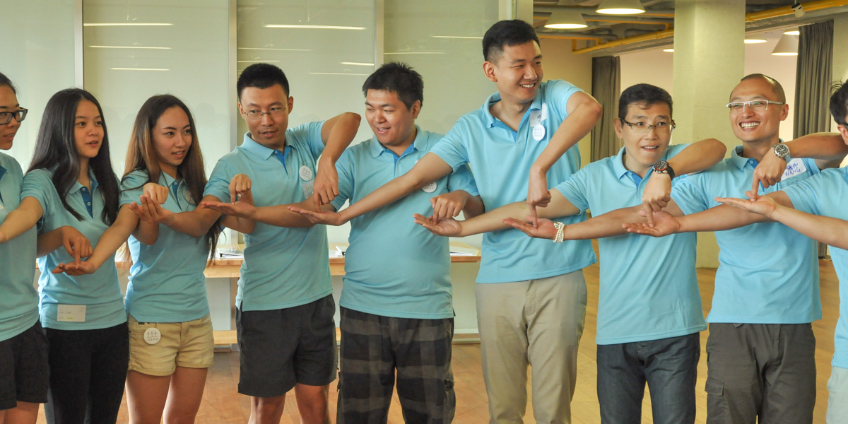Training workshop participants playing fun team energiser Gotcha in China