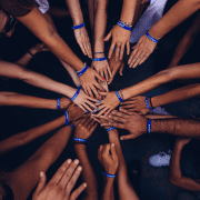 Circle of hands showing power of learning together. Credit Perry Grone