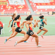 Women running on track demonstrating physical activity. Credit Jonathan Chng