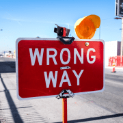 Wrong Way Go Back sign to reflect that team-building is crap. Photo credit: Neonbrand