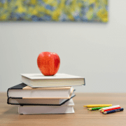 School books with apple to indicate back-to-school program time. Photo credit: Element5