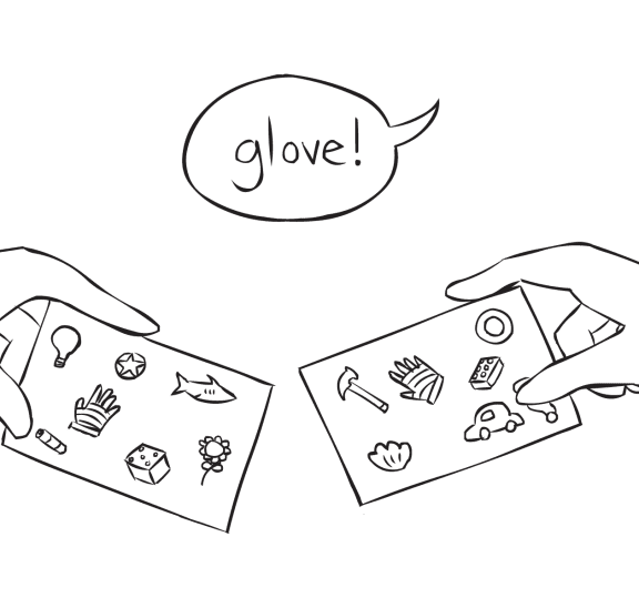 Hands holding two Ubuntu Cards looking for matching objects as connection-building activity