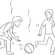 Man hitting ball with open hand towards another person, as seen in fun tag & PE game called Ga-Ga
