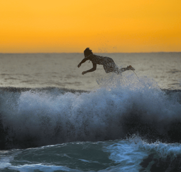 Surfer flipping off board trying to learn from experience. Credit Debora Cardenas