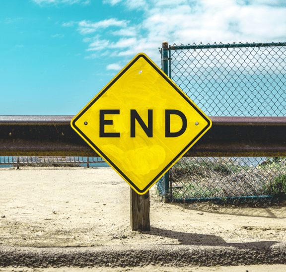 Road sign pointing to end long-term programs. Credit: Matt Botsford