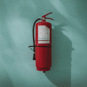 Fire extinguisher on wall keeping people safe