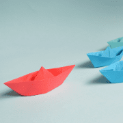 paper boats following a red lead paper boat team building activity & professional development